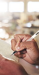 Person, hands and carpenter writing with document in workshop for furniture development or finance. Carpentry, employee or taking notes with clipboard for financial planning, timber or lumber project