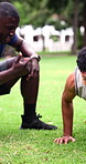 Fitness, push up and man outdoor with coach for exercise routine, training and muscle workout. Athlete person, park and support with motivation for health, wellness and strength challenge in nature