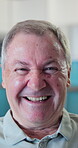 Senior, man and happy with face in home for peaceful morning, positive attitude and healthy aging. Pensioner, elderly person and laugh in house for comfortable retirement, weekend break and wellness