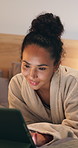 Night, bed and woman on tablet in hotel for online itinerary,  digital streaming and subscription. Happy, hospitality and person relax on tech for internet, research or travel schedule for holiday