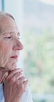 Old woman, thinking and window for perspective in home, history or nostalgia with memory. Person, senior citizen and thoughtful with remember, insight or introspection with mindfulness in house