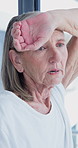 Tired, thinking and senior woman in home with nostalgia, fatigue or remember financial stress. Serious, burnout and elderly person with planning retirement with low pension in apartment on weekend.