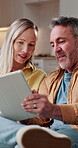Couple, tablet and discussion for interior design in home, renovation planning and online ideas. Mature, people and conversation with technology, house remodeling and app for decor with vision