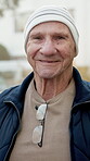 Face, senior and man outdoor in retirement home, happy and wellness with positive attitude in old age. Male person, portrait and smile with pensioner, elderly and good mood with wellbeing in backyard