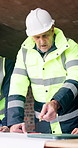 Architecture, group and meeting on construction site with blueprint, property development or discussion. Engineer, men and manager in building with design document, plan or advice for infrastructure