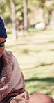 Receive, food drive and homeless man with parcel at park for poverty relief, meal support or aid. Community outreach, poor person and grocery outdoor for giving back, human dignity and helping hands