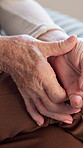 Hands, old woman and wrist pain in home with arthritis, carpal tunnel and osteoporosis or injury. Massage, inflammation and joint ache or hurt with senior person and wrinkled skin or chronic disease