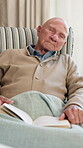Nursing home, retirement and old man with book, sleeping and peaceful nap in living room or fatigue. Exhausted, pensioner and senior person with novel, resting and comfortable on couch in lounge