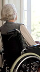 Nursing home, old woman and decision in wheelchair, thinking and lonely with thoughts or reflection. Retirement, future and senior person with disability, nostalgia and remembering past in house