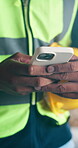 Phone, engineer and hands of man on construction site for project, renovation or text message. Architect, building inspection and property developer with person for communication and contractor