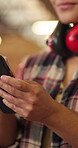 Person, hands or carpenter with phone in workshop for manufacturing update, reading message or smile. Happy woman, woodwork and mobile for project feedback, text or communication for production info