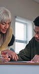 Professor, student and man in university with help, notebook or conversation for academic assignment. Teacher, person talk and explain assessment in college with learning, education and assistance.