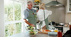 Dance, cooking and senior couple in home kitchen with energy, bonding and love in marriage. Happy, food and ingredients for health and people with hug, music and teamwork in house for retirement