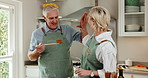 High five, cooking and happy couple in home kitchen with success, bonding and love in retirement. Perfect, food and ok gesture for taste and people with approval, talking and hug for help in house