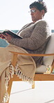 Bible, faith and reading with old woman in living room for Christian belief or spiritual study. Book, learning and religion with senior person on chair in retirement home for gospel, hope or trust
