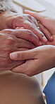 Comfort, old person and nurse in home with holding hands, understanding or empathy in health assistance. Sympathy, senior woman and caregiver with compassion, patient support or trust in medical care