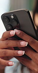 Woman, hands and phone in home for message, social media post and nail salon review on website. Person, mobile and typing in house for booking appointment, feedback or manicure recommendation in text