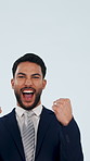 Face, businessman and winning with celebration in studio for promotion on a blue background. Portrait, happy man or employee with smile or fist pump for business achievement, bonus or good news