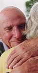 Happy, friends and senior man with hug for support, care or appreciation for lifelong relationship. Love, elderly people and embrace in retirement home for visit, reunion or talking with connection