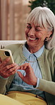 Phone, smile and senior woman on sofa in home for texting, research or chatting on mobile app. Relax, technology and elderly person in retirement with reading blog, website or social media in house.