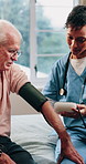 Nurse, senior and patient with blood pressure machine in bedroom for healthcare checkup or exam. Woman, health worker or monitoring man with arm strap for medical test or elderly care in nursing home