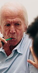 Help, brushing teeth and senior man with caregiver in bathroom for grooming, clean and hygiene. Elderly person, woman and support for self care, toothbrush or listen to advice in assisted living home