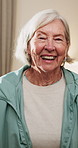 Smile, face and senior woman in home for wellness, relax and happy for comfort in retirement. Laugh, portrait and elderly person in house with positive outlook, peace and good memories or nostalgia