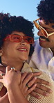 Happy, hug and couple by beach on holiday, getaway or weekend trip for bonding in marriage together. Smile, sunglasses and man embracing woman with love, trust and care by ocean on summer vacation.