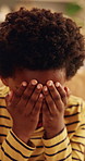 Sad, crying and kid with depression in home, loneliness and thinking of bad memory with trauma. Reflection, unhappy child and African boy with anxiety, stress and mental health crisis in lounge