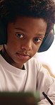 Writing, headphones and kid with tablet for education, homework or online course in home. Study, tech and african child with video for learning tips, copy notes and productivity with audio assessment