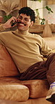 Phone call, relax and man on sofa in home for communication, catch up or gossip in living room. Happy, cellphone and person on mobile conversation, connectivity or contact on weekend in apartment.