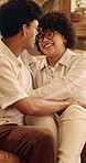 Hug, couple and happy on home sofa with love, connection and support or care in healthy relationship. Man, woman or people with glasses on lounge couch with comfort, security and safety in house
