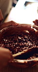 Mix, hands and mother with child with batter in kitchen for baking, dessert or cupcakes in home. Stirring, wooden spoon and mom with kid for teaching with chocolate mixture for cake in house.