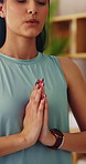 Yoga, prayer hands or woman in house with meditation, calm practice or mindfulness in wellness. Inner peace, breathing or person in lounge with namaste, zen or mindset improvement for holistic health