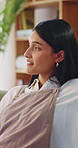 Calm, thinking and woman on sofa in home for decision, ideas or planning for weekend break. Smile, choice and person in living room with reflection, nostalgia or remember memory in apartment.