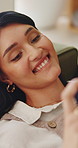 Woman, relax and laugh on sofa with phone, watching comedy movie and online entertainment on weekend. Happy, female person and rest in home with tech, internet connectivity and streaming funny show.
