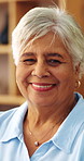 Face, smile and senior woman in home with peace, laughing and unwind with positive attitude on weekend. Portrait, happiness and person at apartment, retirement and funny with wellness on break