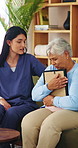 Picture frame, caregiver and comfort old woman with grief for memory, loss and empathy in homecare. Photo, carer and sad senior widower in assisted living for mourning, nostalgia or emotional support