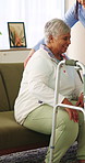Nurse, woman and senior with walker in home for assisted living, mobility or medical aid. Caregiver, healthcare worker or helping female person with a disability for walking, movement or elderly care