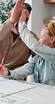 Education, dad and high five with child in house, hug and happy for academic success and motivation. Family home, knowledge and celebration for achievement, mature man and studying with daughter