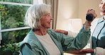 Weight, consultation and physiotherapist with senior woman in clinic with arm exercise for recovery. Physical therapy, dumbbell and medical worker with elderly person for rehabilitation at checkup.