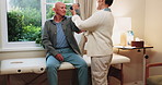 Weight, checkup and physiotherapist with senior man in clinic with arm exercise for recovery. Physical therapy, dumbbell and medical worker with elderly person for rehabilitation at consultation.