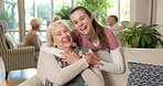 Face, old woman and caregiver with hug in homecare for health support, wellness check or kindness. Retirement, happy senior patient or carer in assisted living for service gratitude, embrace or laugh
