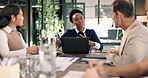 Woman, team and laptop for conversation in office for meeting, proposal or review at real estate agency. People, realtor and consultant with tech for investor, property development or insight chat