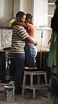 Renovation, dance and couple in kitchen for break, rest and prepare for diy remodeling together. Happy, marriage and African man and woman with music for bonding, love and embrace with house upgrade