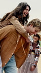 Couple, piggyback and laughing with friends in nature, playing and bonding on holiday in countryside. Outdoor, happy people and fun together on adventure, travel and smile for reunion on vacation