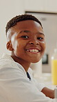 Breakfast, face and smile of black child at table in dining room of home for development or growth. Eating, food and wellness with happy boy in apartment for morning meal, nutrition or vitality
