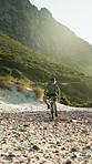 Man, fitness and ride in nature with mountain bike, sports training or helmet for endurance challenge. Active, person and cycling outdoor on rocky terrain with bicycle, gear and workout for wellness.