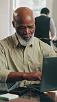 Laptop, small business and typing with man in barbershop for management, planning or research. Computer, online booking and schedule with mature person at hairdresser for agenda, report or review