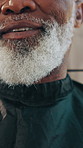 Beard, hands and man with cape in barbershop for grooming, trim or hair removal service at business. People, hairstylist and mature client with apron for cover with customer experience at salon.